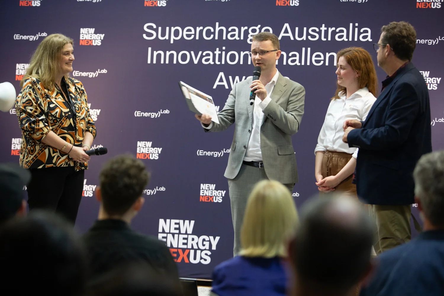 Kyle Van Berendonck accepts award at awards ceremony